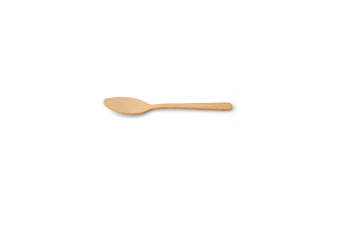A single beige bamboo dessert spoon against a white background.