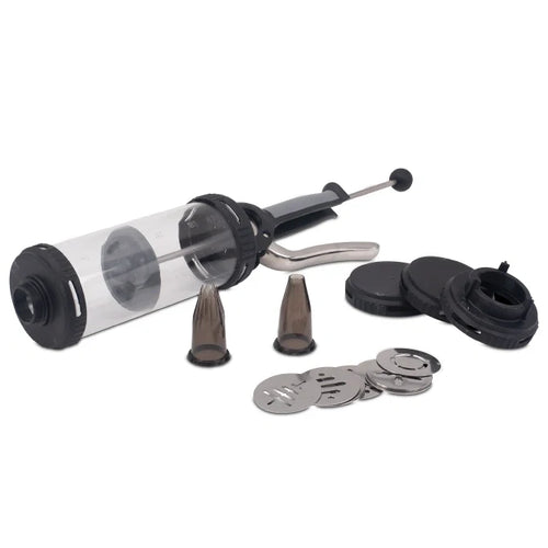 A pressure syringe with a clear container, metallic parts and black rubber components, alongside two nozzle attachments.