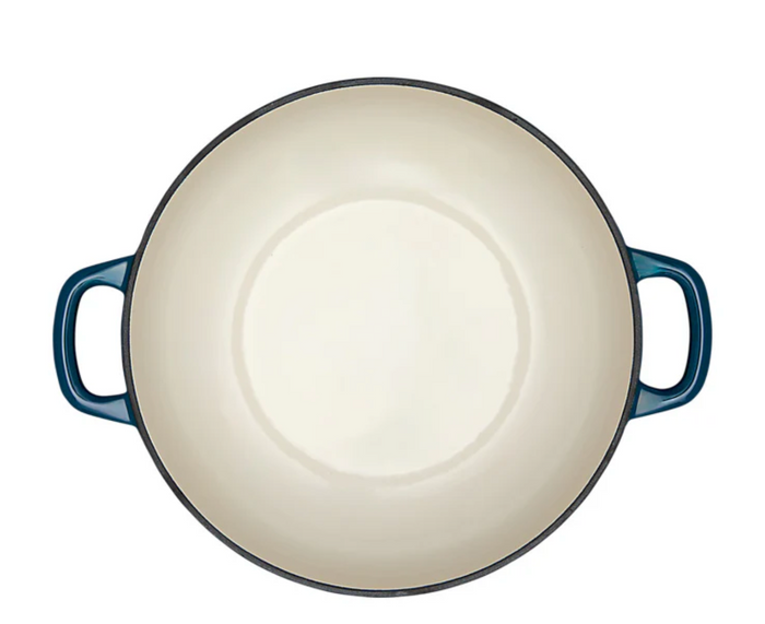 Blue enameled cast iron Dutch oven on a white background